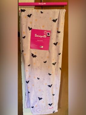 Betseyville plush blanket pattern of black bats yellow stars lavender background